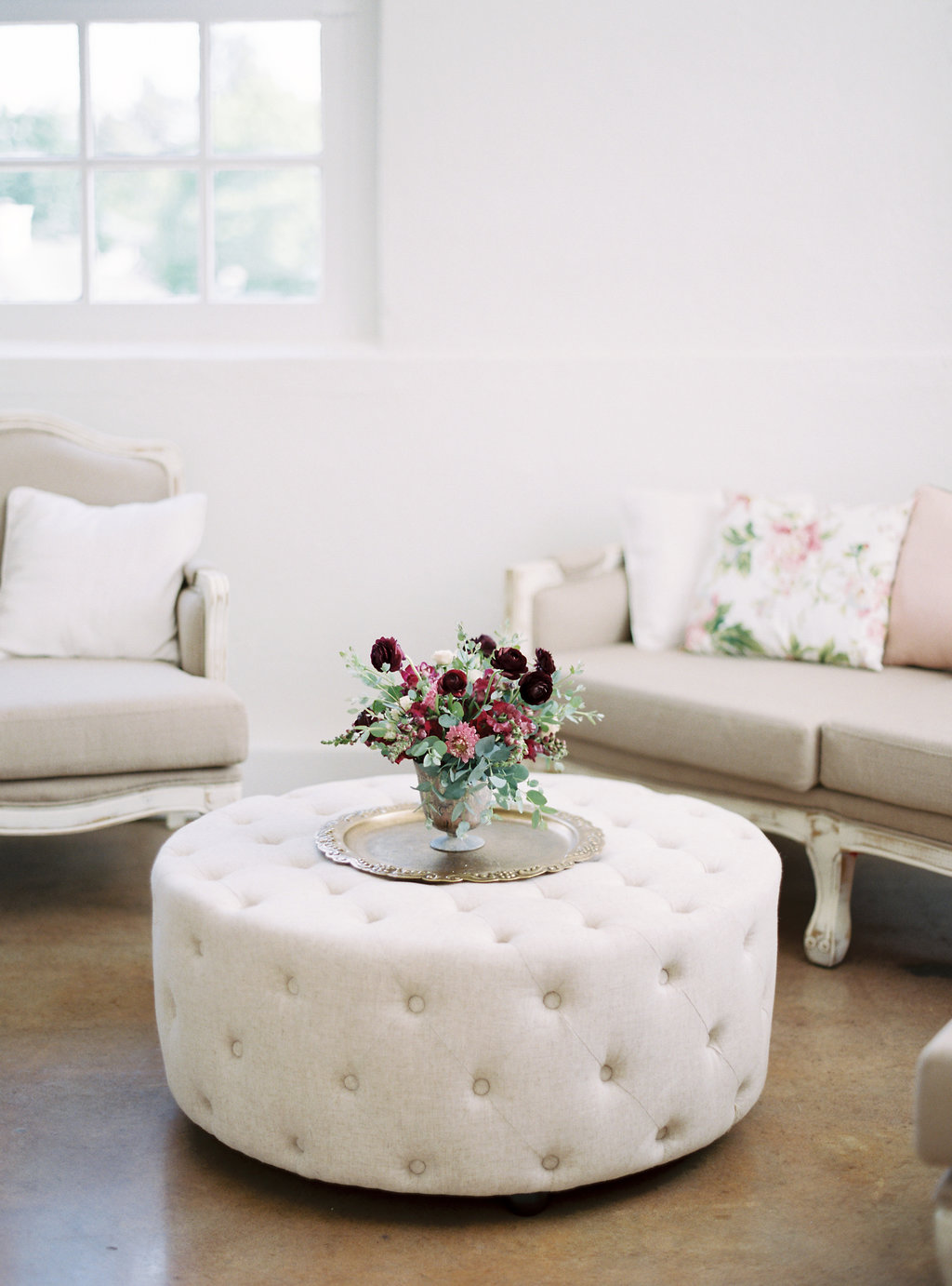 Emily Tufted Ottoman styled for wedding.